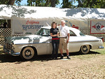 May be an image of 2 people, car and text